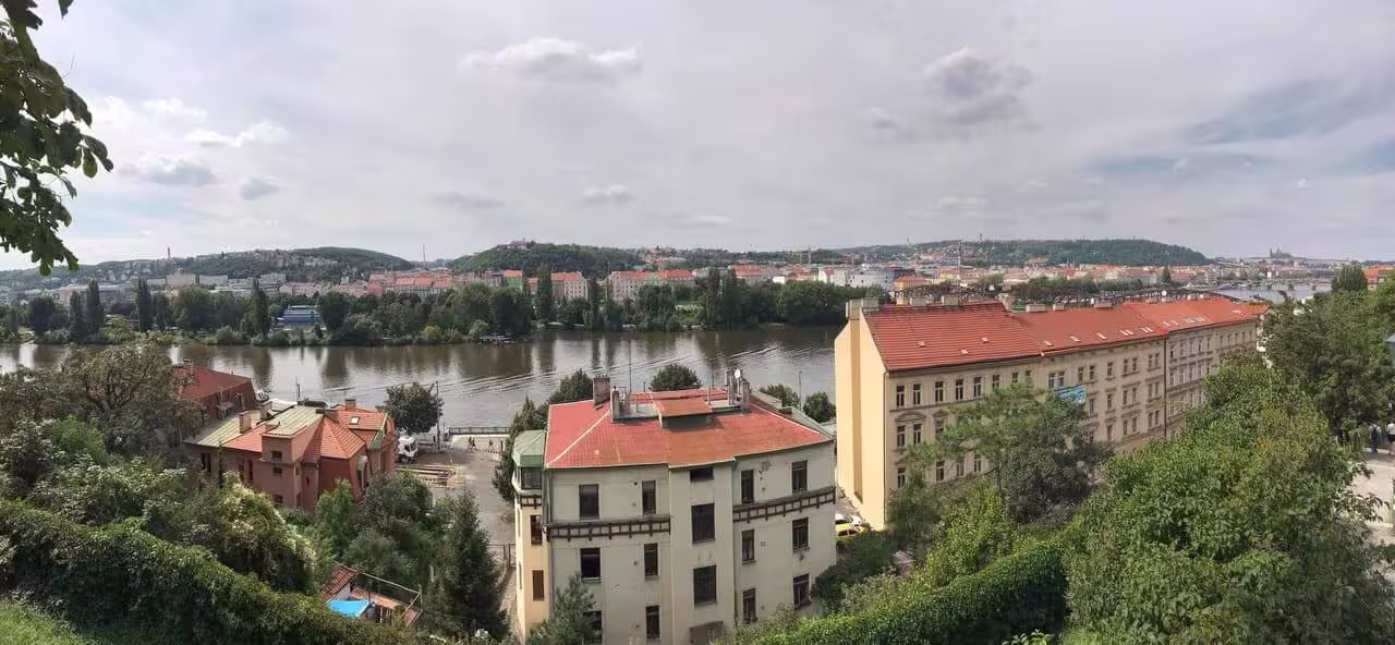 Charles Bridge over the Vltava River in Prague at dusk